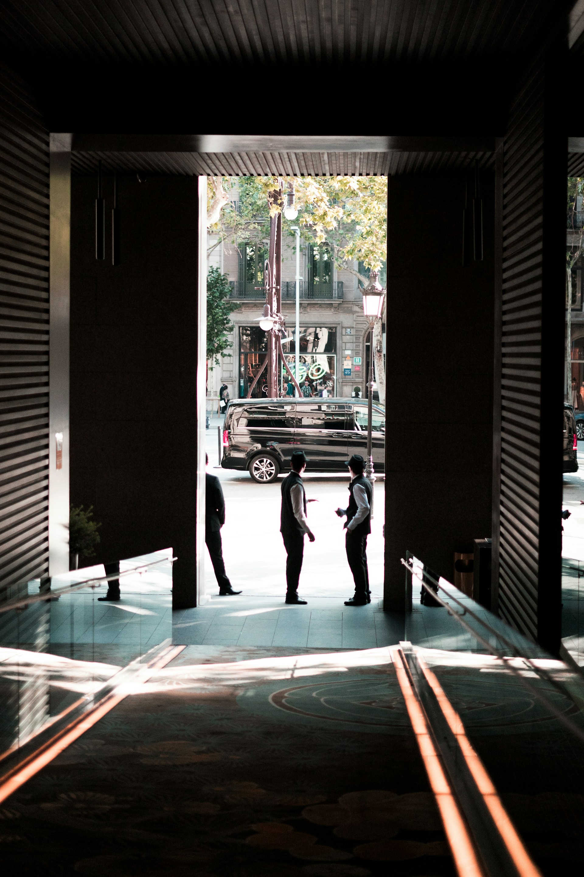 a group of people standing outside of a building