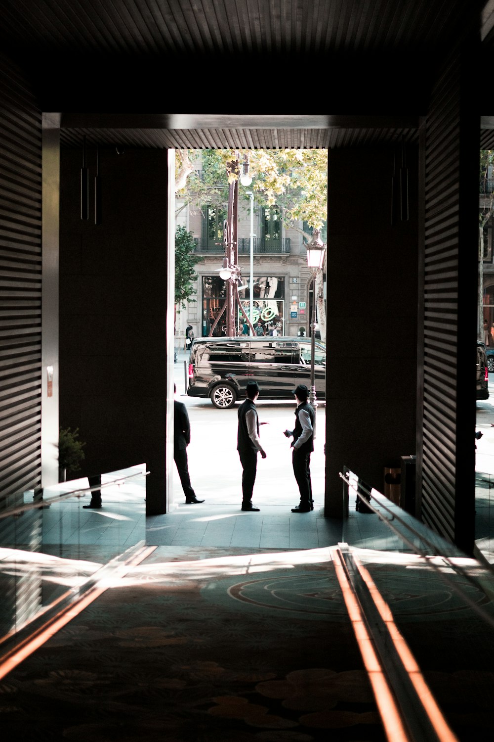 a group of people standing outside of a building