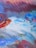 A vibrant abstract painting with dynamic swirls of color on a white canvas.