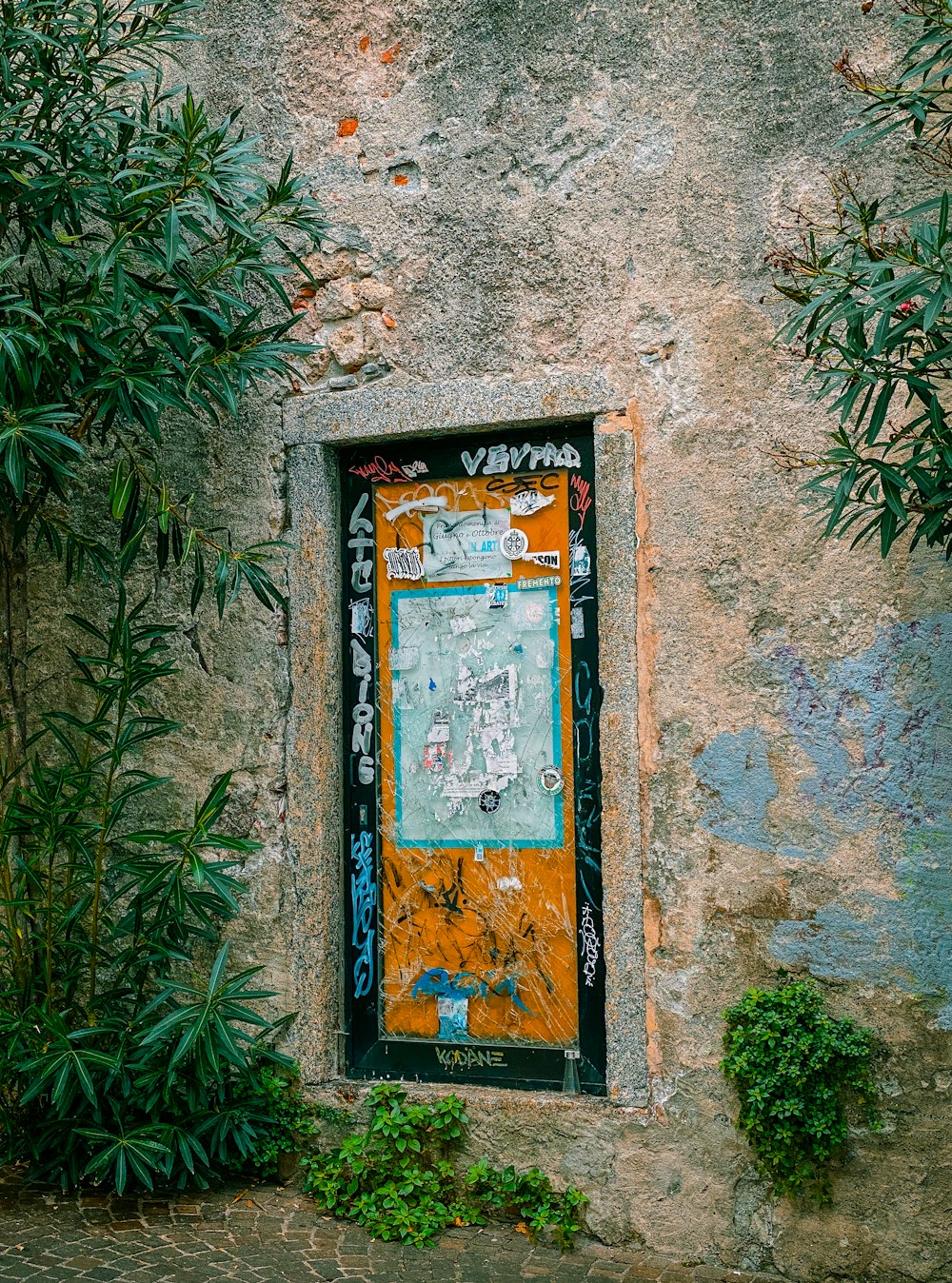 a picture of a door with graffiti on it