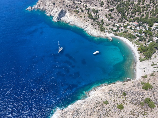 an aerial view of a boat in the water