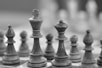 a black and white photo of a chess board