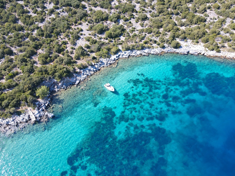 an aerial view of a boat in the water