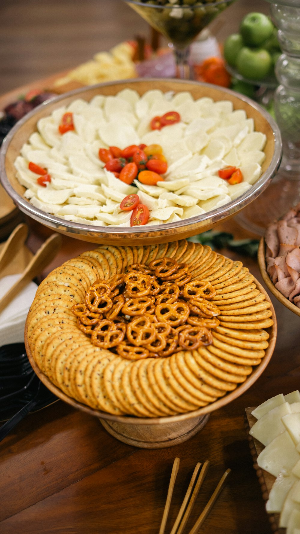 a wooden table topped with plates of food