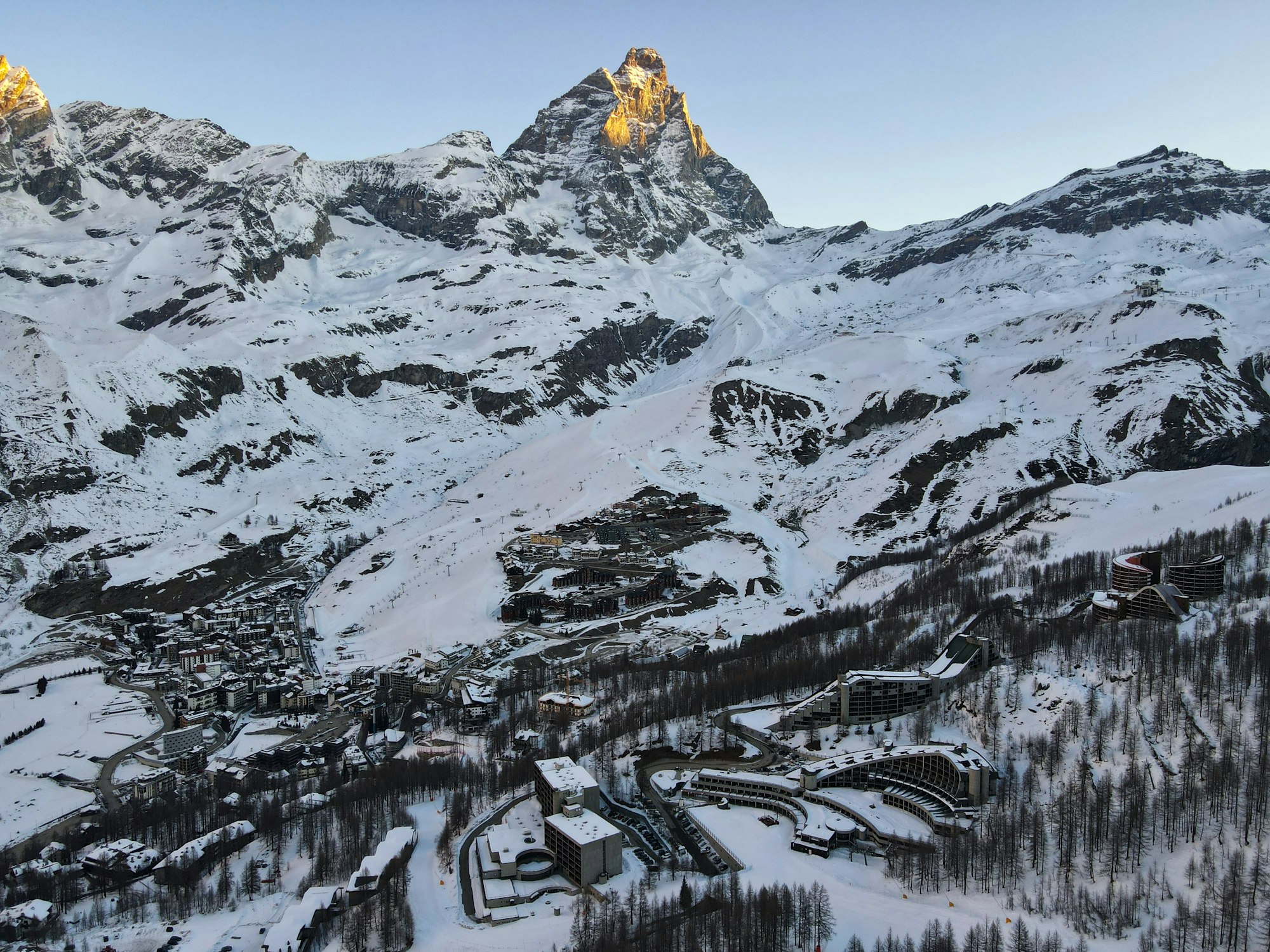 View above the valley of Breuil-Cervinia with snow-covered peaks in the Italian Alps