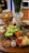 A vibrant spread of gourmet, organic meals beautifully arranged on a wooden table, showcasing fresh ingredients and colorful dishes.