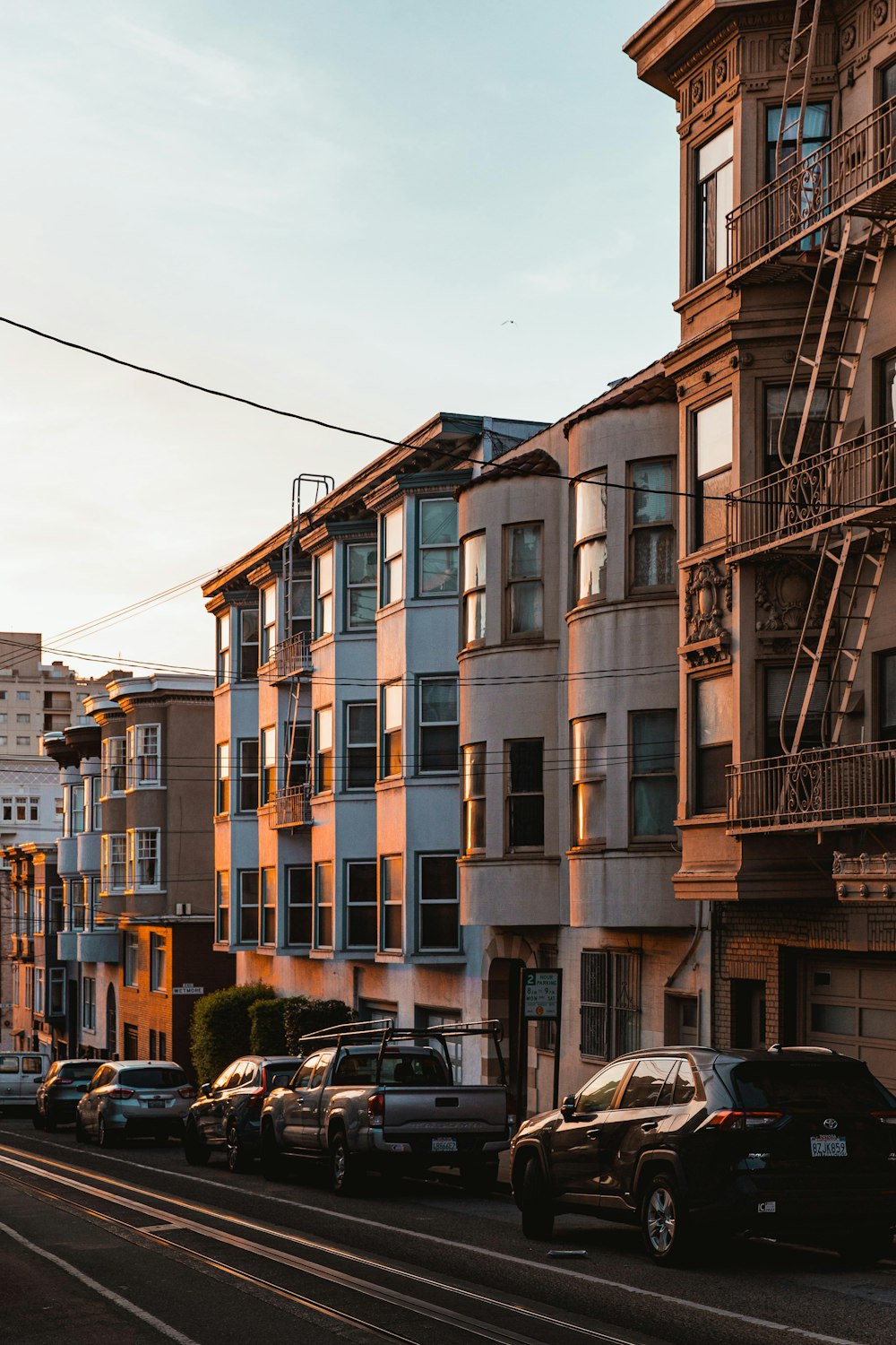 a row of apartment buildings on a city street