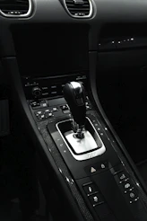 the interior of a car with a gear shift