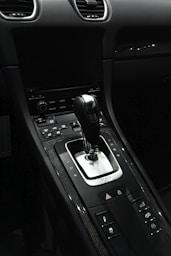 the interior of a car with a gear shift