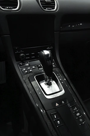the interior of a car with a gear shift