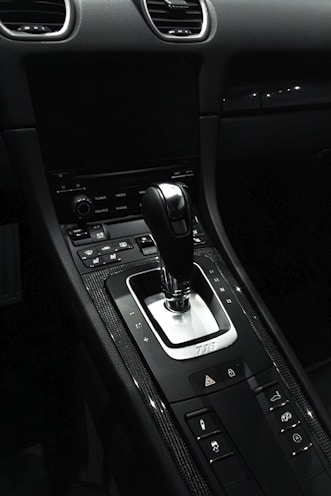 the interior of a car with a gear shift