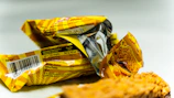 Close-up of scientific papers and fresh food samples arranged for nutritional analysis.