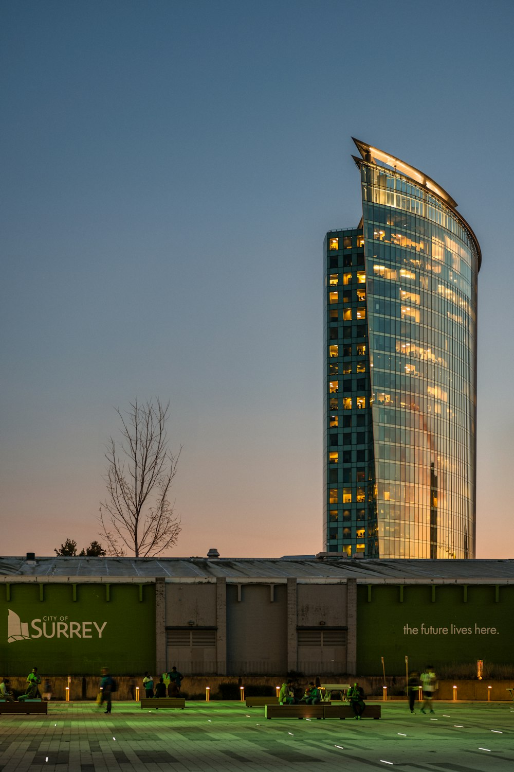 a very tall building sitting next to a parking lot