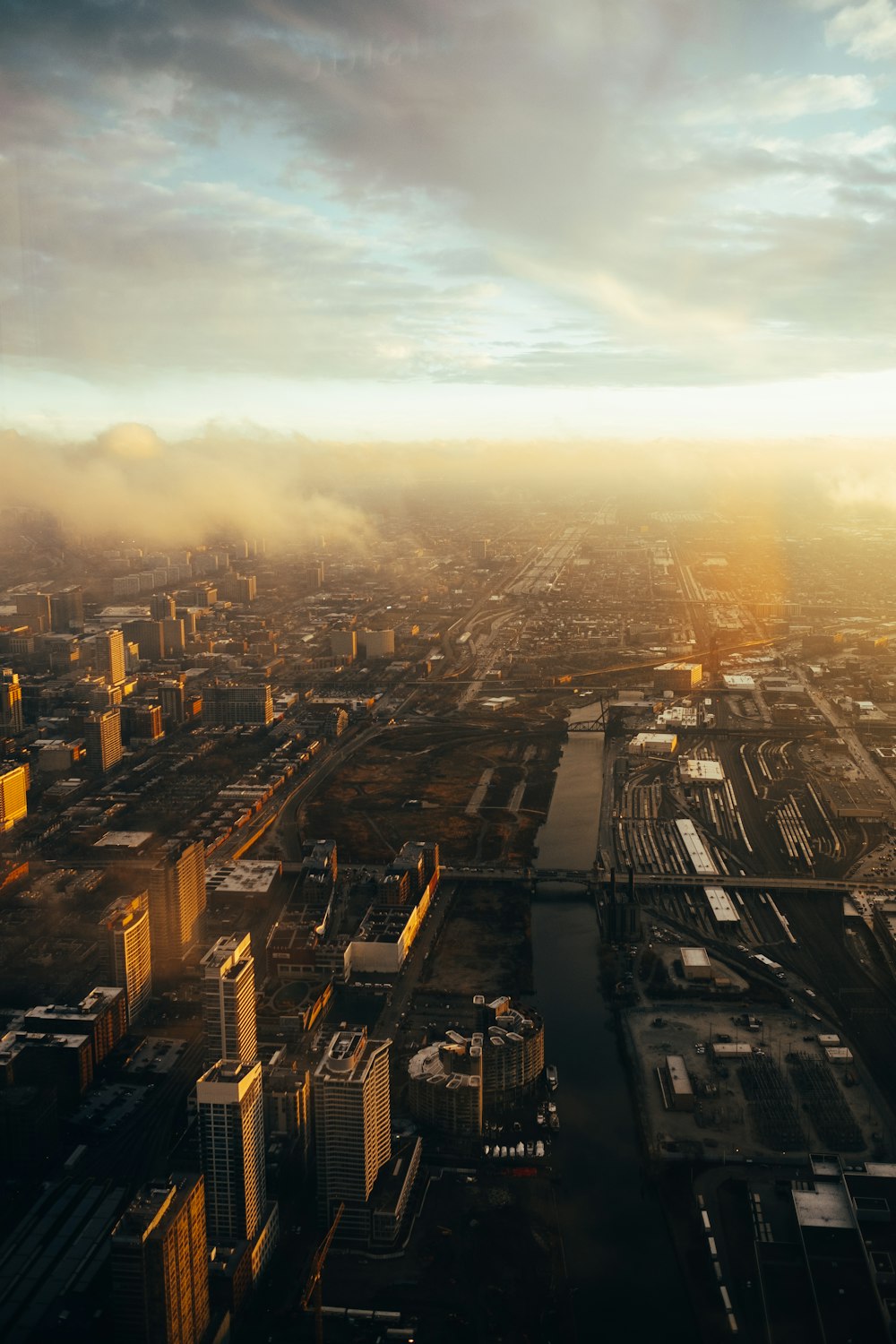 an aerial view of a city with tall buildings