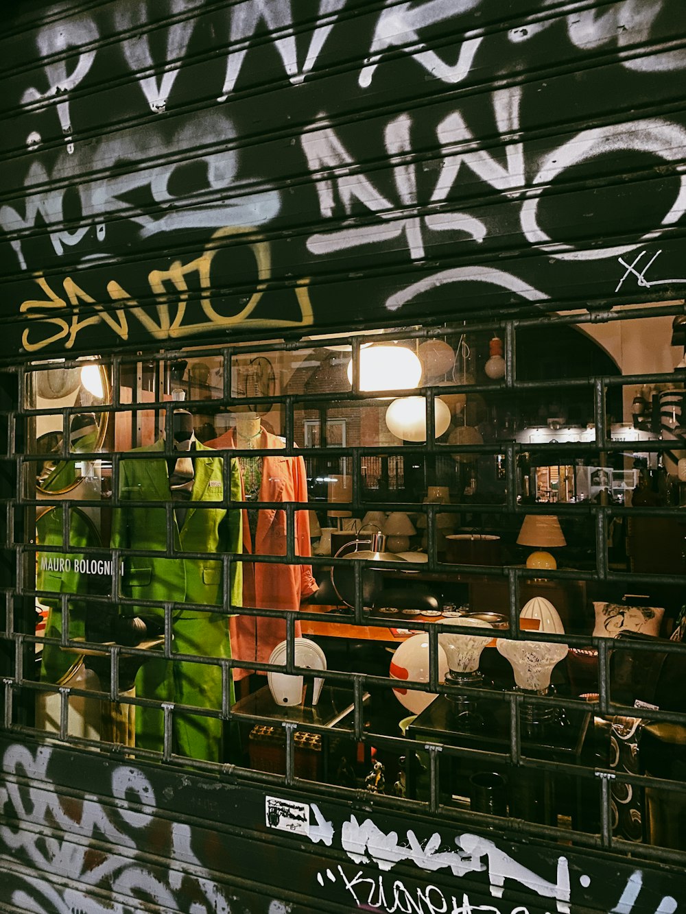 a store front with a lot of graffiti on it