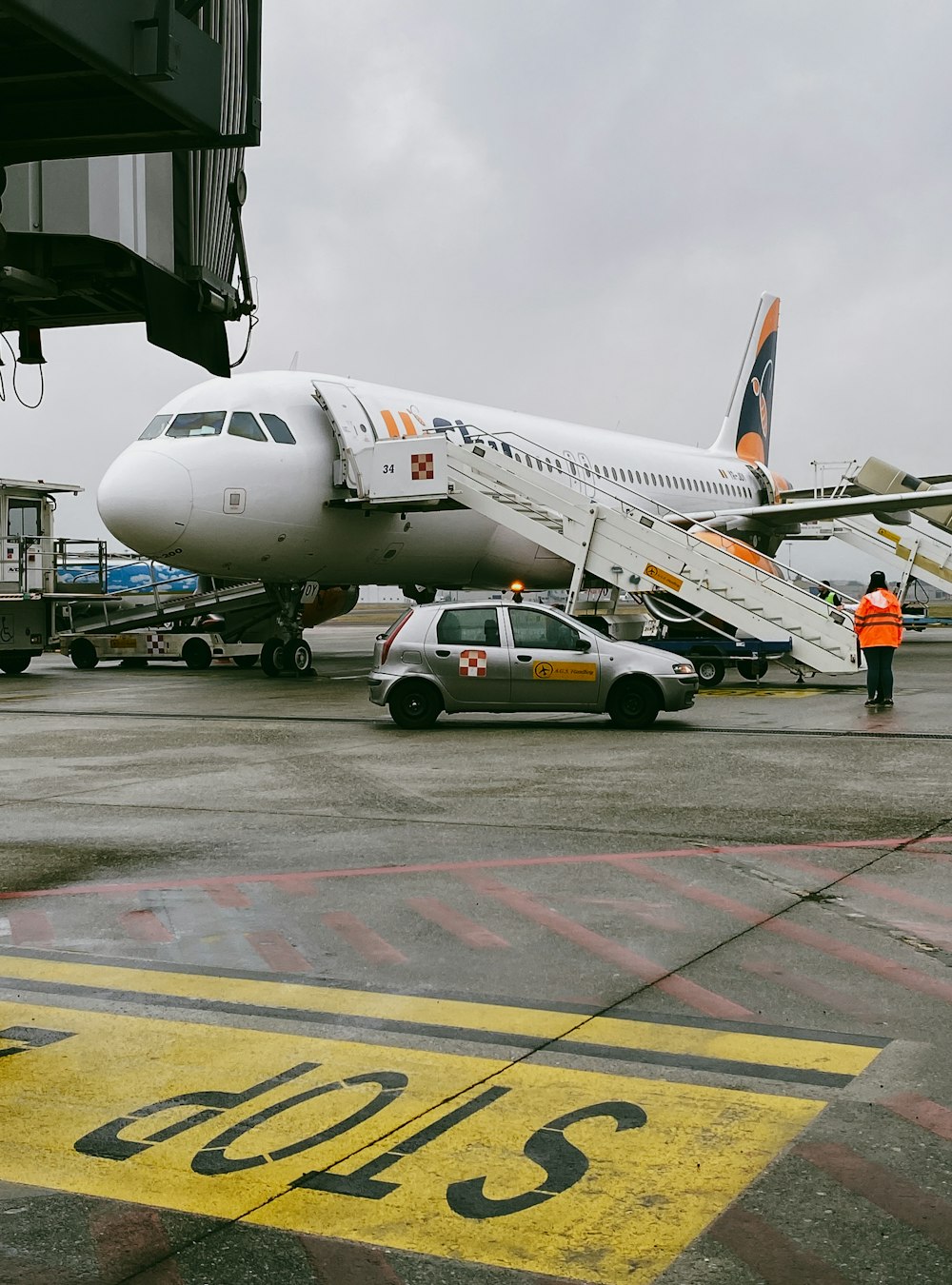 a large jetliner sitting on top of an airport tarmac