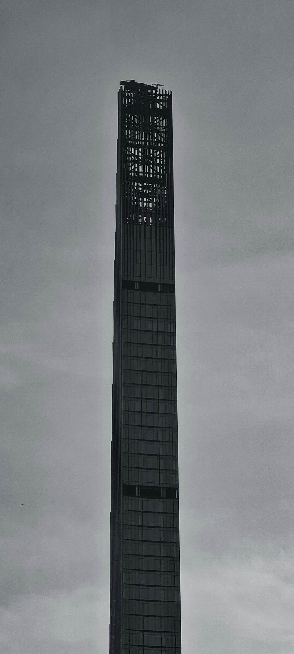 a very tall building with a clock on it's side