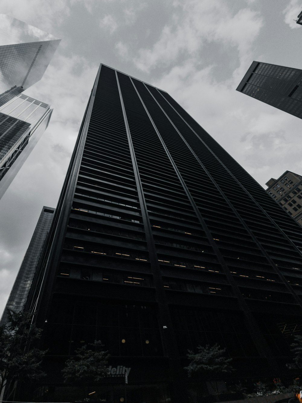 a black and white photo of tall buildings