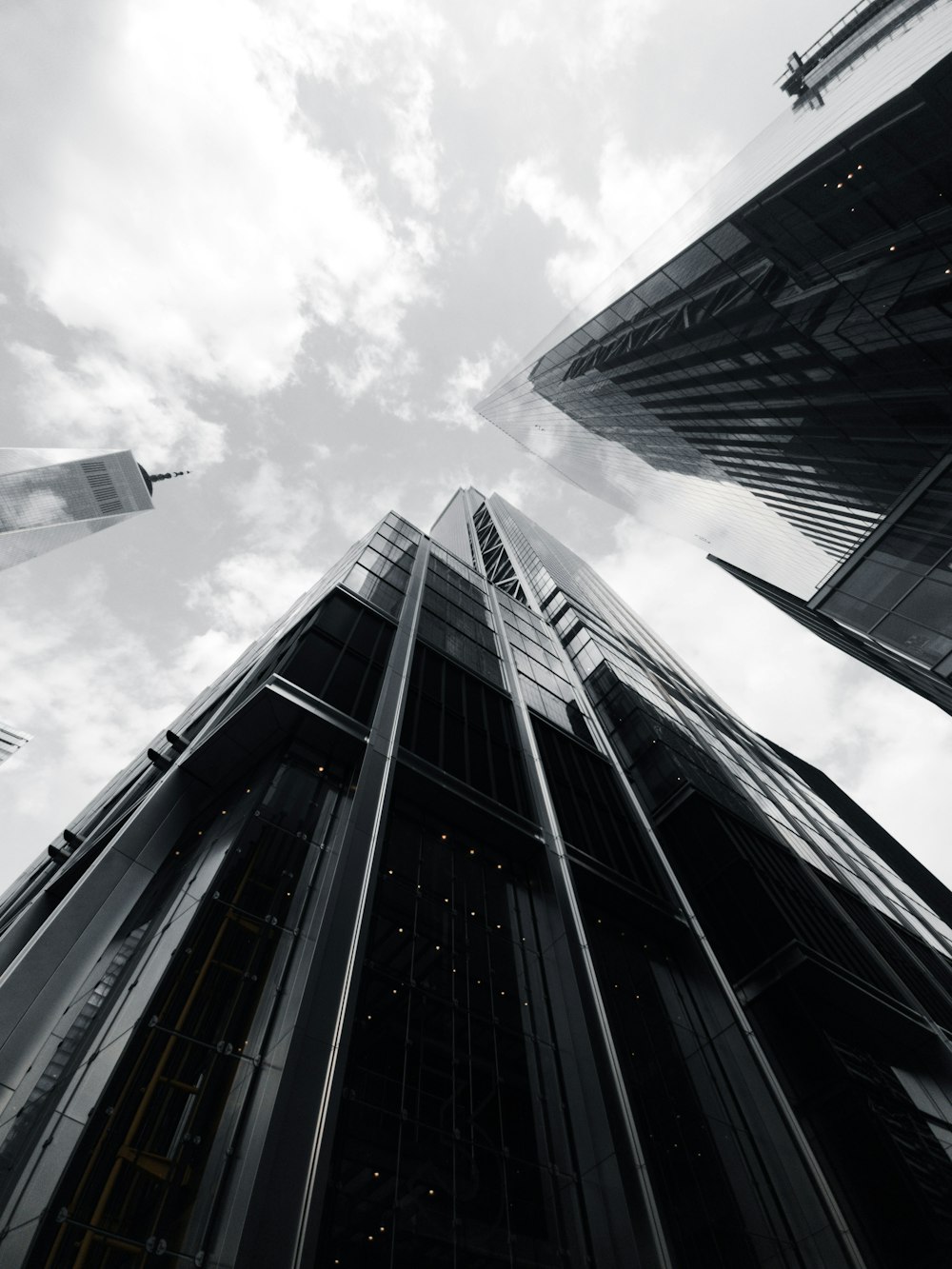 a black and white photo of tall buildings