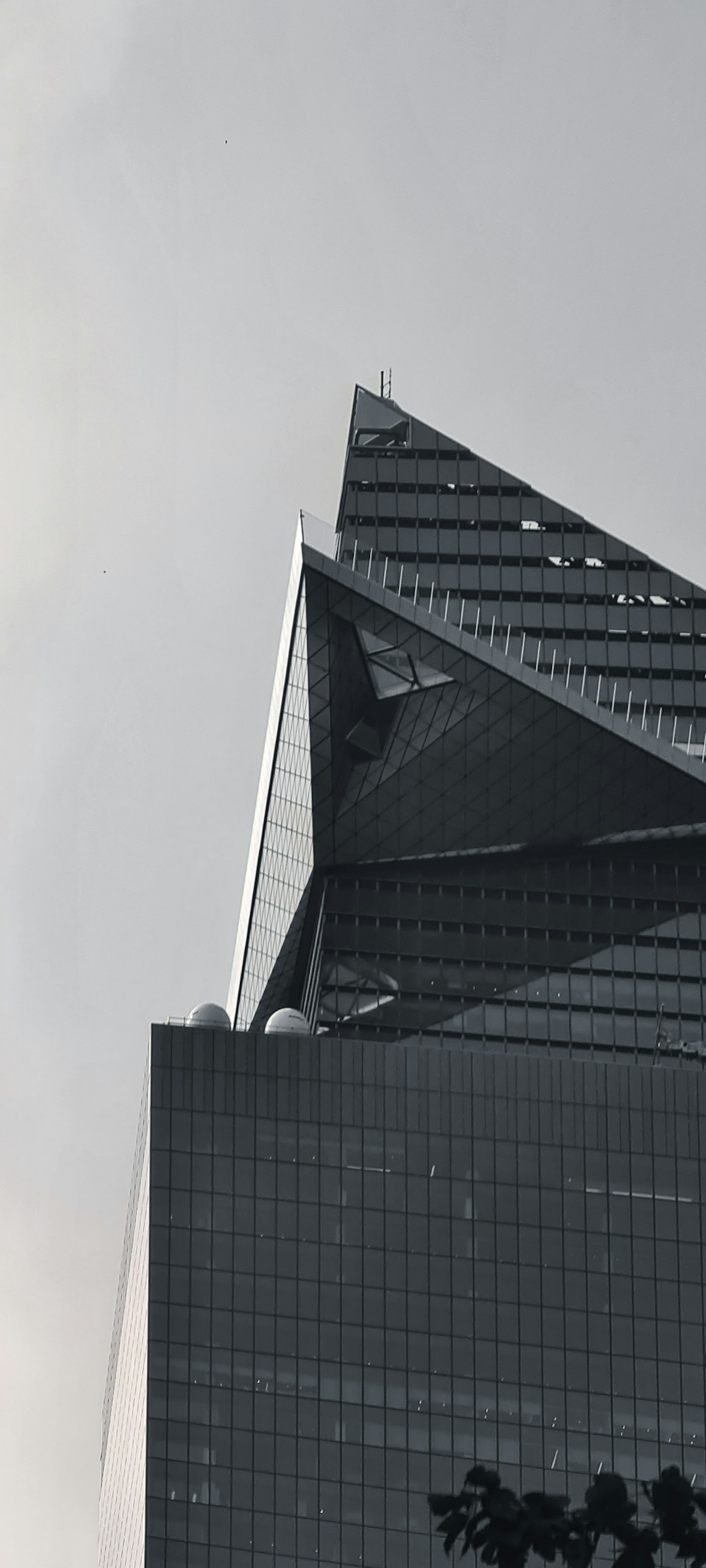 a black and white photo of a very tall building