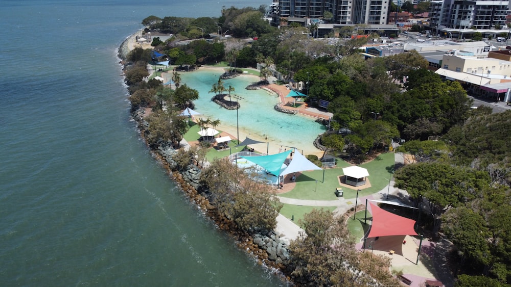 an aerial view of a resort with a swimming pool