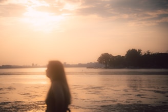 A serene scene of a person standing at a crossroads during sunset, symbolizing choice and new beginnings.