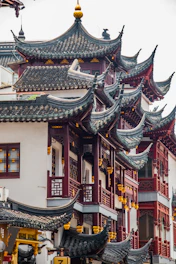 a building with a lot of windows and roof tops