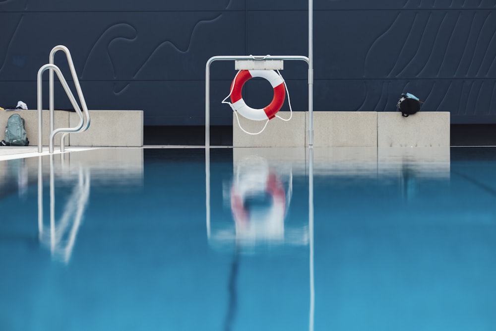 a swimming pool with a life preserver next to it