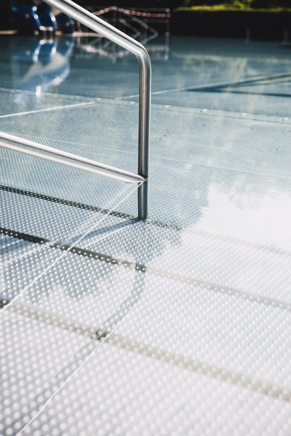 a skateboarder is going down a metal hand rail