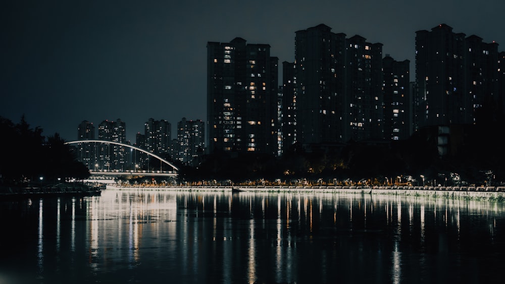 a large body of water with a city in the background