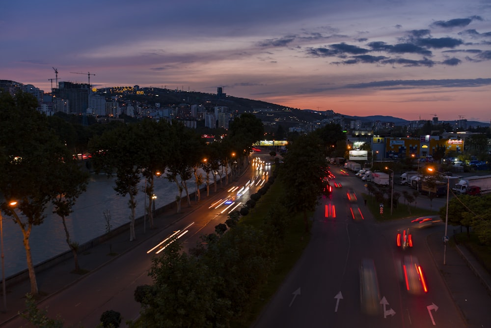 a view of a city street at dusk