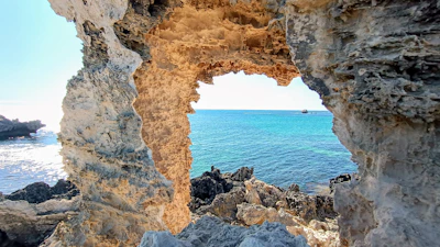 View of rocky formations near the Arch at Cabo San Lucas with calm ocean water