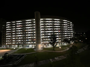 Night view of a well-lit residential complex highlighting the quality of construction.