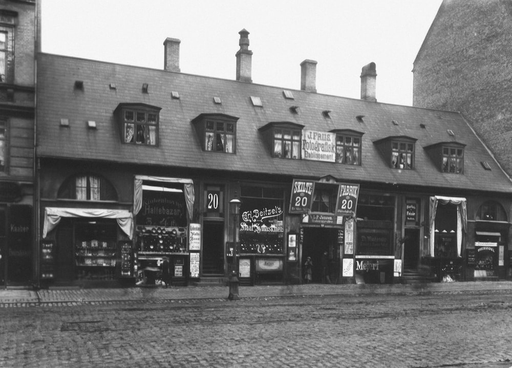 a black and white photo of a store front