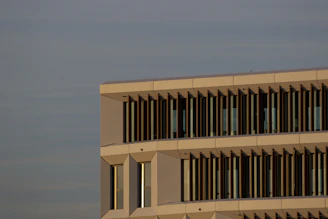 Minimalist architectural detail of a modern building facade in warm neutral tones.