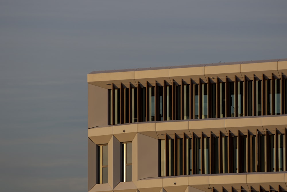 a tall building with many windows on top of it