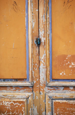 Before and after shots of a repaired and painted door frame showing the transformation.