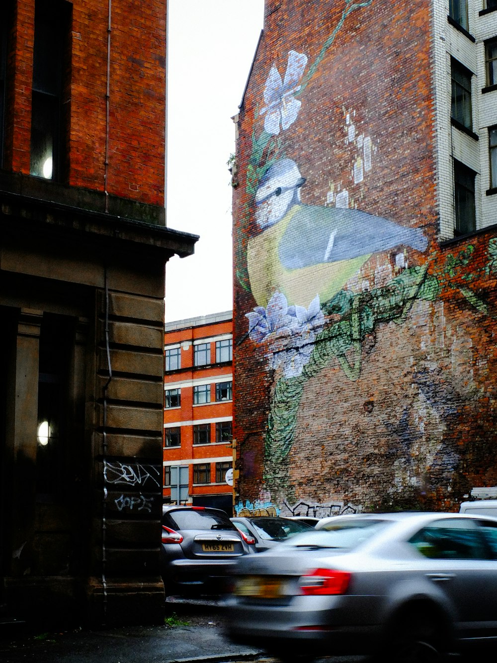 a building with a bird painted on the side of it