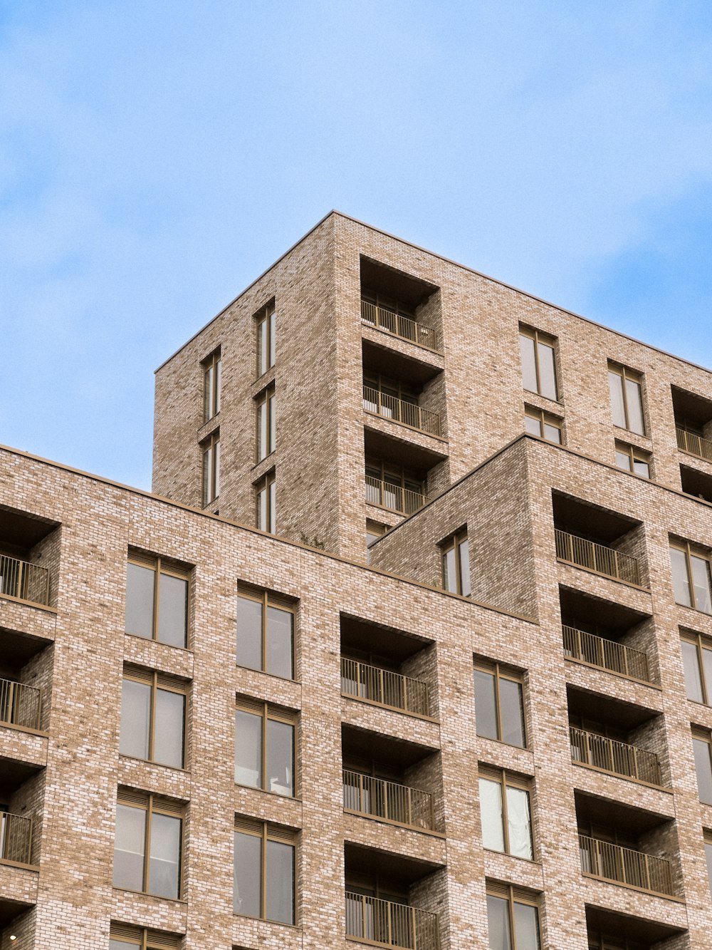 a tall brick building with lots of windows