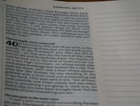 A close-up image of an open Bible page showing text from the book of Ezekiel, specifically chapter 40:11. The text is formatted in two columns with a section title in bold reading 'The temple area restored'. The paper is off-white, and the printing is in black ink.