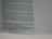 A close-up of a page from a book with printed text, mainly describing measurements and architectural details. The text appears in a structured format, possibly indicating a passage from a religious or historical document, with footnotes or references at the bottom.