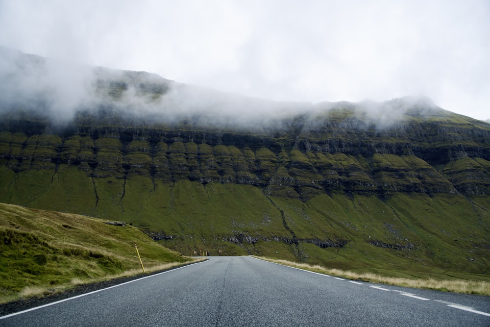 a road with a mountain in the background