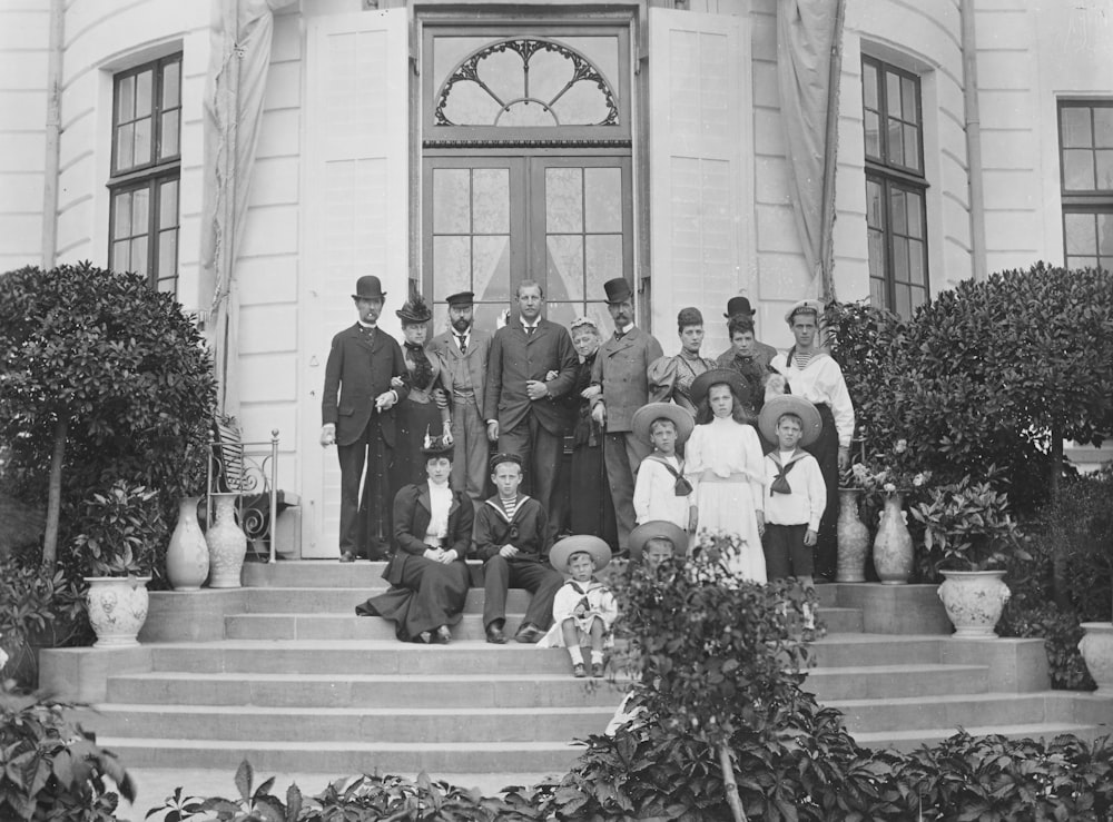 a group of people standing on the steps of a building