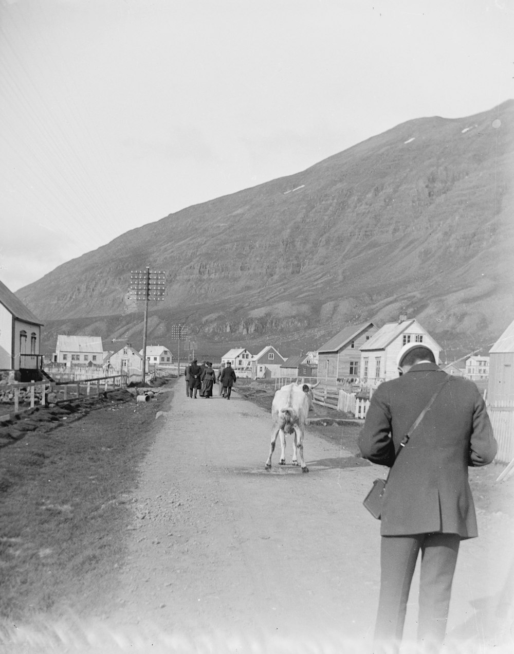 a black and white photo of a man on a skateboard