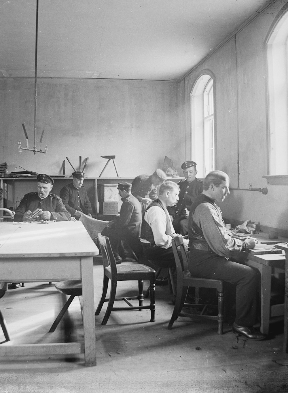 a group of people sitting around a table in a room