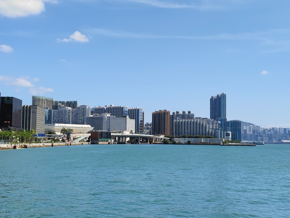 a large body of water with a city in the background