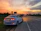 Elegant silver sedan parked by a scenic Nairobi street with sunset lighting.