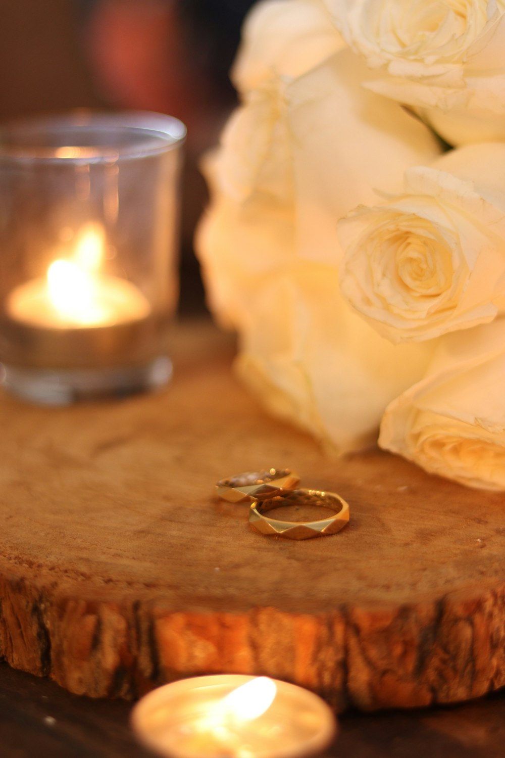 a couple of rings sitting on top of a wooden table