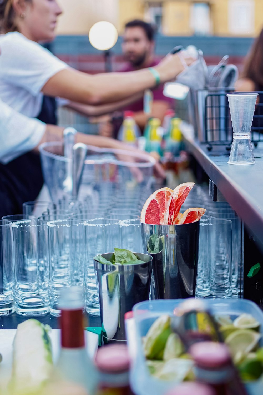 a group of people sitting at a bar with drinks