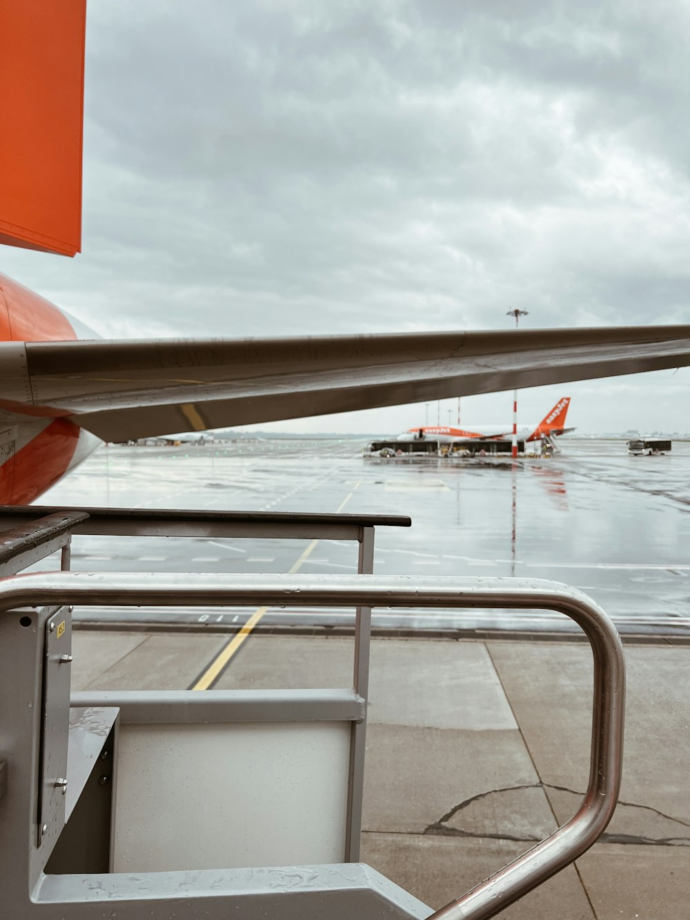 an airplane is parked on the tarmac at the airport